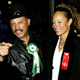 Judge Joe Brown and wife Rhonda Brown (R) poses for a photo before the start of the 72nd Annual Hollywood Christmas Parade November 30, 2003 in Los Angeles, California.